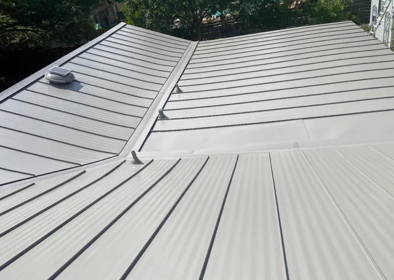 Solar attic fan installed on a metal roof for Roof Ventilation in Pacific